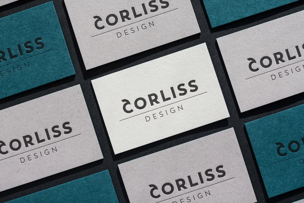 Brand Design von und für Corliss Design, zu sehen sind Visitenkarten mit Letterpress