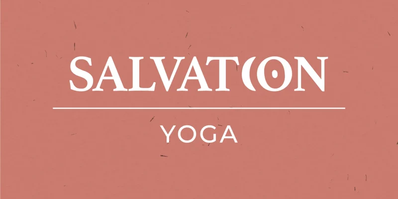 Logo erstellt von Corliss Design für Salvation Yoga, zu sehen ist das Logo auf rotem Hintergrund