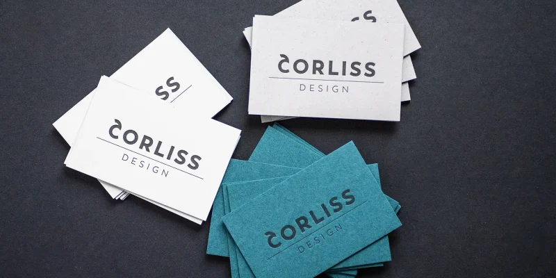 Brand Design von und für Corliss Design, zu sehen sind Visitenkarten mit Letterpress